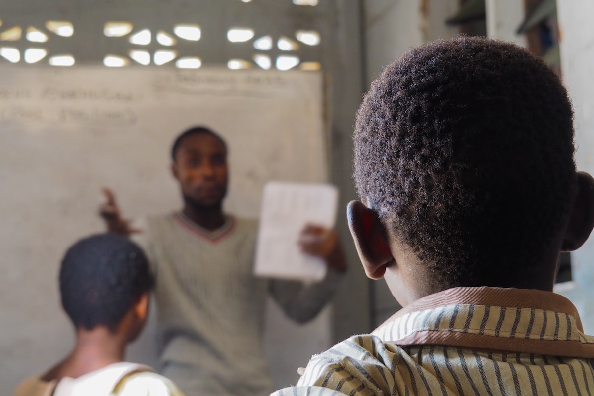 A teacher guiding students during a lesson